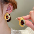 Gold Tone Red Teardrop Necklace and Stud Earrings with Polished Metal Accents view 2