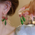 Pink and Green Glass Leaf Cluster Huggie Earrings With Metal Details view 1