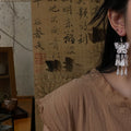 Silver Butterfly Floral Tassel Hook Earrings with Polished Metal Details view 2