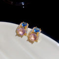 Pink and Blue Crystal C-Hoop Earrings with Polished Metal Details view 1