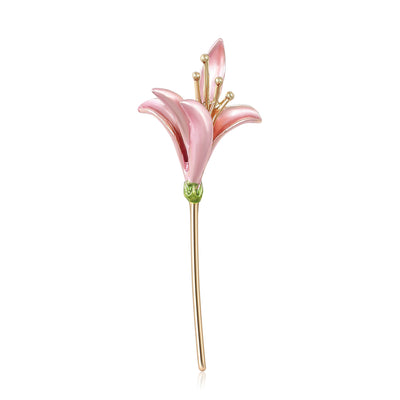 Pink enamel lily flower brooch upright on white background