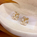 Gold Tone Crystal Flower Huggie Earrings with Layered Petals view 6