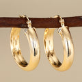 Textured Gold-Tone Hoop Earrings in Ten Sculpted Styles view 1