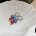 Blue And Red Mushroom Huggie Earrings With Decorative Details view 3
