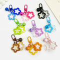 Acrylic Hollow Star Keychain With Bell And Colored Swivel Clasp Charm view 1