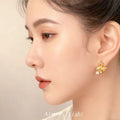 Gold Tone Sculpted Three Petal Flower And Clear Stone Stud Earrings view 2