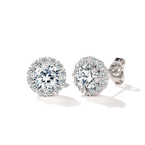 Two silver round halo clear CZ stud earrings on white surface