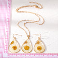 Gold Tone Teardrop Pressed Daisy Resin Necklace and Earring Options view 4