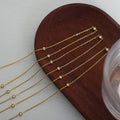 Gold Bezel Station Necklace Clear Crystal Spaced Cable Chain view 3