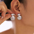 Seashell Drop Stud Earrings Gold And Steel Polished Metal view 3