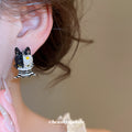 Black and White Cat Stud Earrings with Striped Bodies and Gold Details view 3