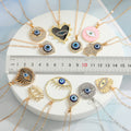 Assorted Crystal Evil Eye and Hamsa Pendant Necklaces in Twelve Designs view 2