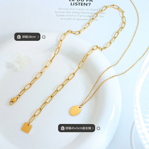 Gold short paperclip and long oval necklaces flat with length labels