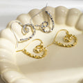 Hammered Gold and Silver Spiral Heart Hook Earrings view 2