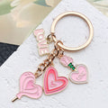 Pink Love Heart Rose and Potion Metal Keychain Set view 4