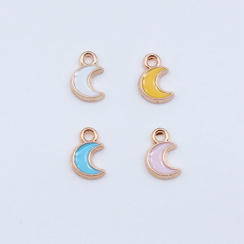 Front display of crescent moon charms on a light background