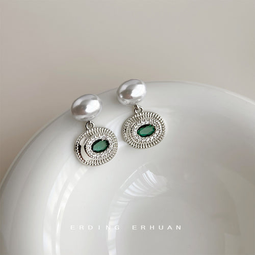 Silver-tone white-pearl-top green-oval-medallion drops in the first product display.