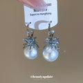Silver Crystal and Pearl Huggie Earrings with Floral Accents view 2