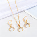 Gold Tone Crystal Double Horn Necklace and Huggie Earring Options view 1