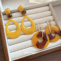 Resin Circle and Teardrop Earrings in Warm Yellow Tones view 2