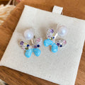 Blue Butterfly Stud Earrings with Crystals and Pearl Like Tops view 6
