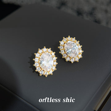 Gold Tone Clear Oval Faceted Stone Double Halo Stud Earrings