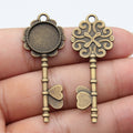 Ornate Key Shaped Round Cabochon Tray Metal Pendants view 3