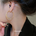 Textured Metal Hoop Earrings in Three Twisted Designs view 4