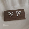 Silver Outline Bow White Pearl Center Stud Earrings Pair Style view 1