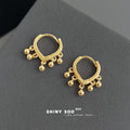 Gold Heart Huggie Hoop Earrings With Dangling Ball Charms view 4