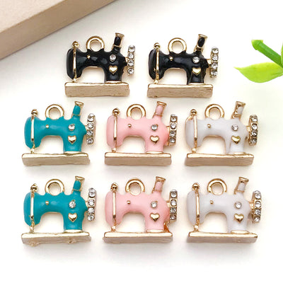Colorful assorted shape charms arranged on a light background