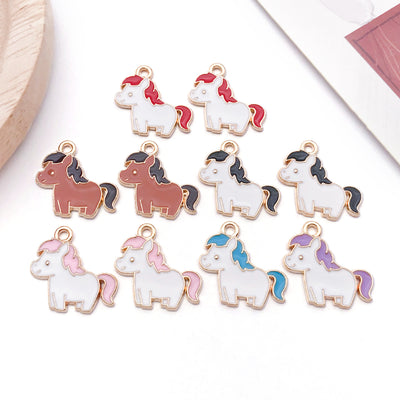Colorful bird charms arranged on a light background