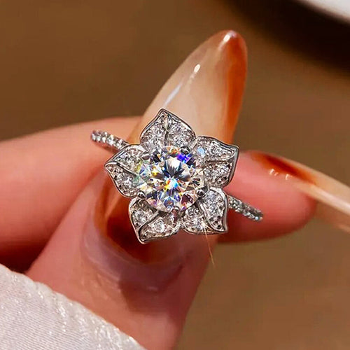 Second product view showing silver-tone round clear-stone floral petal cluster ring