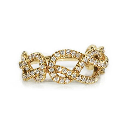 Display view of gold tone crystal interwoven knot band ring polished metal jewelry