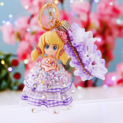 Main image 1 shows a supplied presentation of jeweled plaid dress doll keychains with visible attached key hardware.