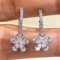 Silver Flower Drop Hoop Earrings In A Polished Decorative Design view 2