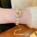 Gold Tone Irregular Pearl Like Slider Bracelet With Shell Charm view 4