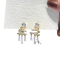 Star Bow Tassel Stud Earrings In Gold And Silver With Decorative Metal Details view 5