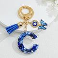 Blue Resin Alphabet Letter Keychain With Butterfly Evil Eye Charm Tassel view 7