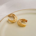 Twelve Gold Tone Sculptural Knot and Hoop Earrings view 10