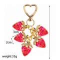 Resin Strawberry Charm Keychain with Enamel Daisy Accent view 3