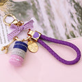 Stacked Macaron and Eiffel Tower Keychains with Braided Wrist Loops view 1