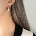 Twisted Chunky Hoop Earrings Gold and Steel Finishes view 6