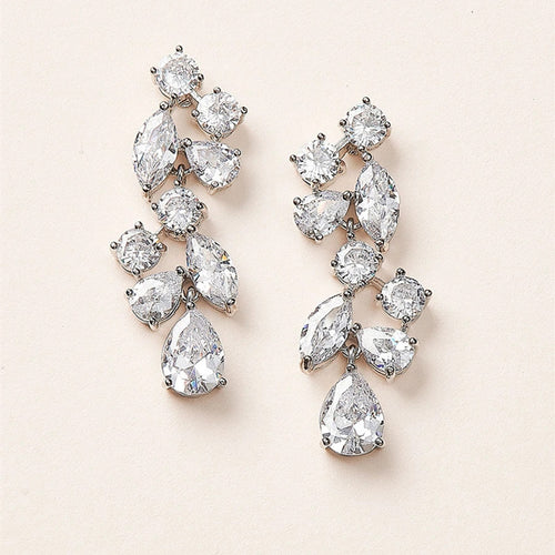 Silver tone leaf cluster drop earrings with clear stones, pair shown from the front
