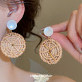 Woven Rattan Circle and White Cabochon Earrings with Decorative Details view 1