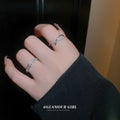Two Silver Tone Open Rings With Overlapping Crystal Bands view 4