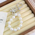 Pearl Beaded Bag Charm With Heart Shaped Clasp And Bow view 3