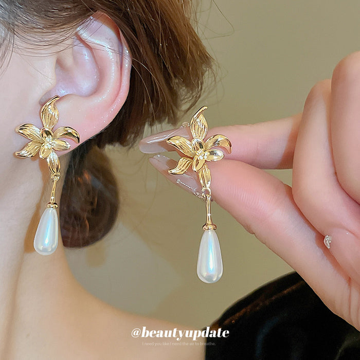 Gold Tone Bow And White Teardrop Pearl Drop Earrings
