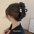 Twelve Mixed Hair Claw Designs With Pearls Flowers Stars And Bows view 4