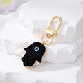Gold Tone Druzy Style Hamsa Evil Eye and Pressed Flower Clip Keychains view 6